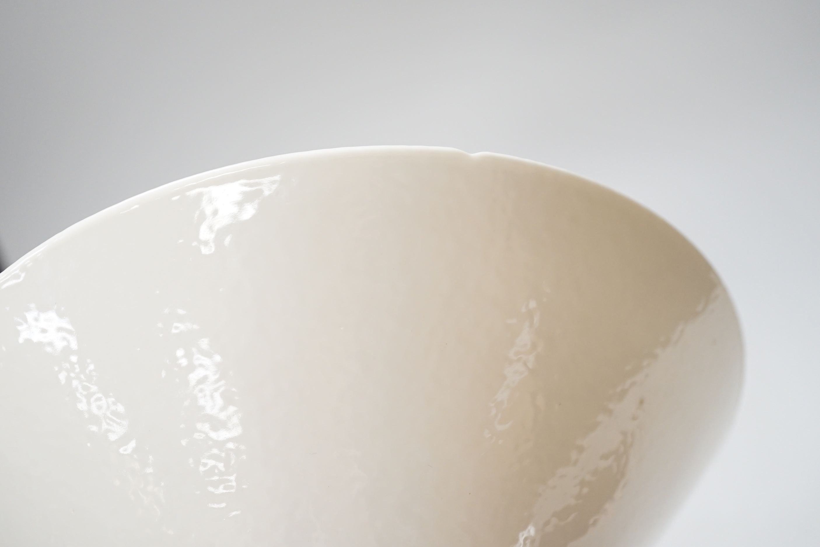 A Chinese white Anhua decorated conical dish, 20cm